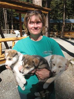 Kathy Frederick with puppies