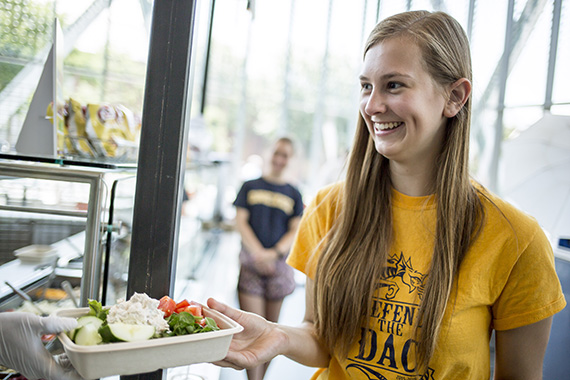 student with salad