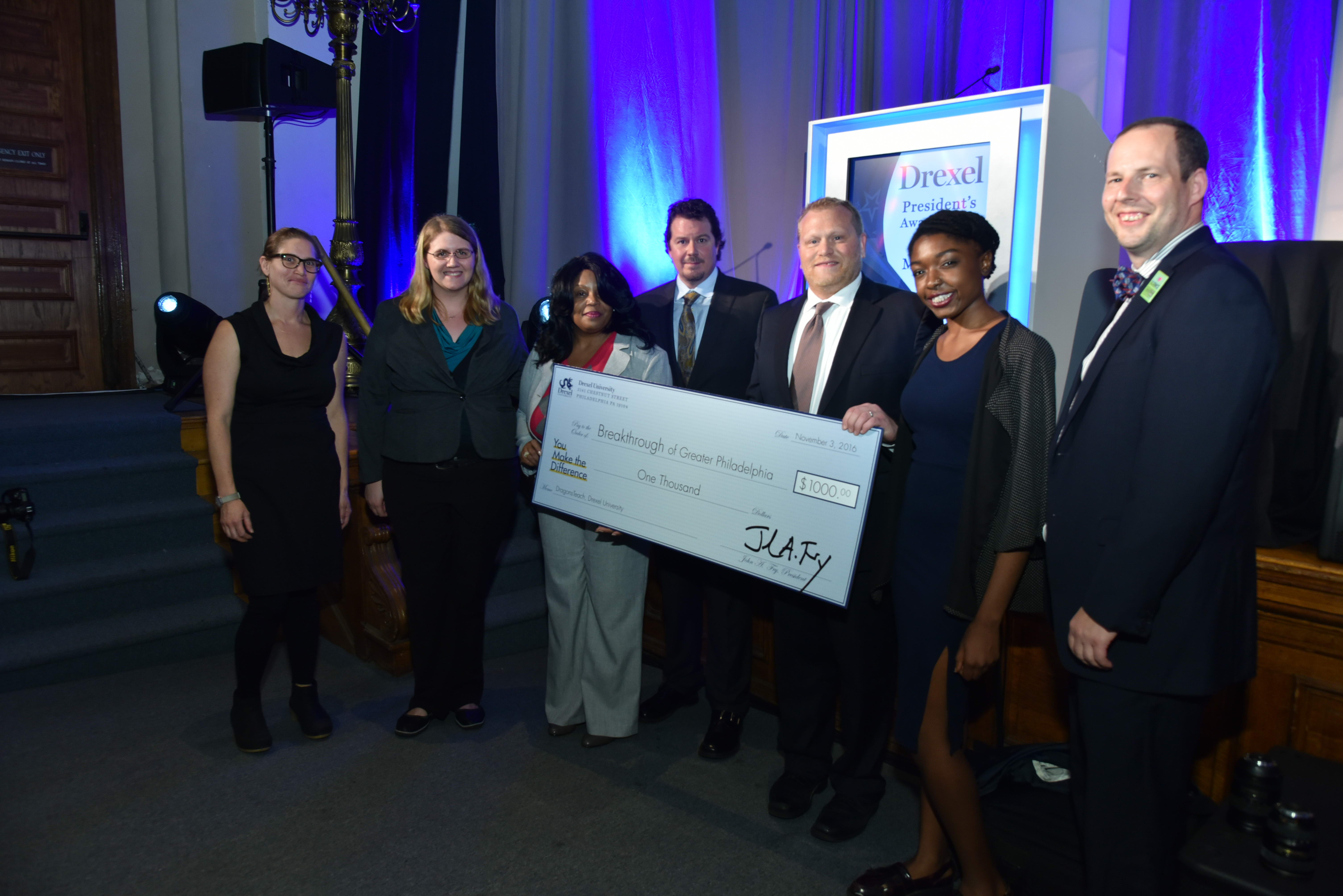 DragonsTeach accepts the Presidents Award for Civic Engagement