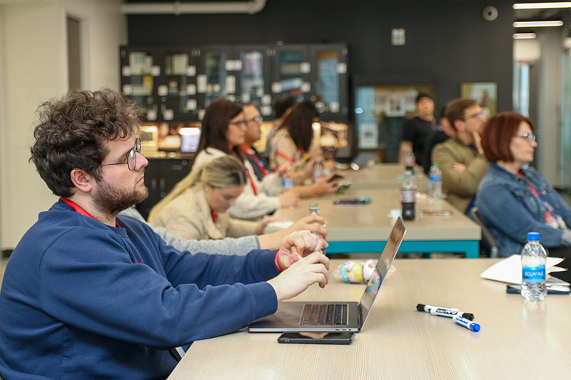 A group listening to a Codefest presentation at CCI.