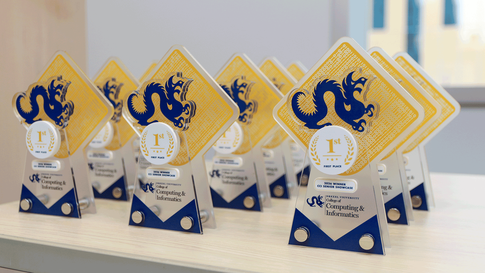 Drexel SCIS Senior Project award trophies on a table.
