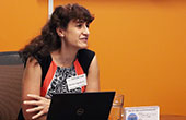 Photo of Professor Denise Agosto presenting with laptop