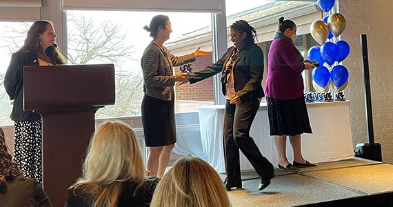 Michelle Rogers receiving graduation award at 2022 ELATES Leaders Forum