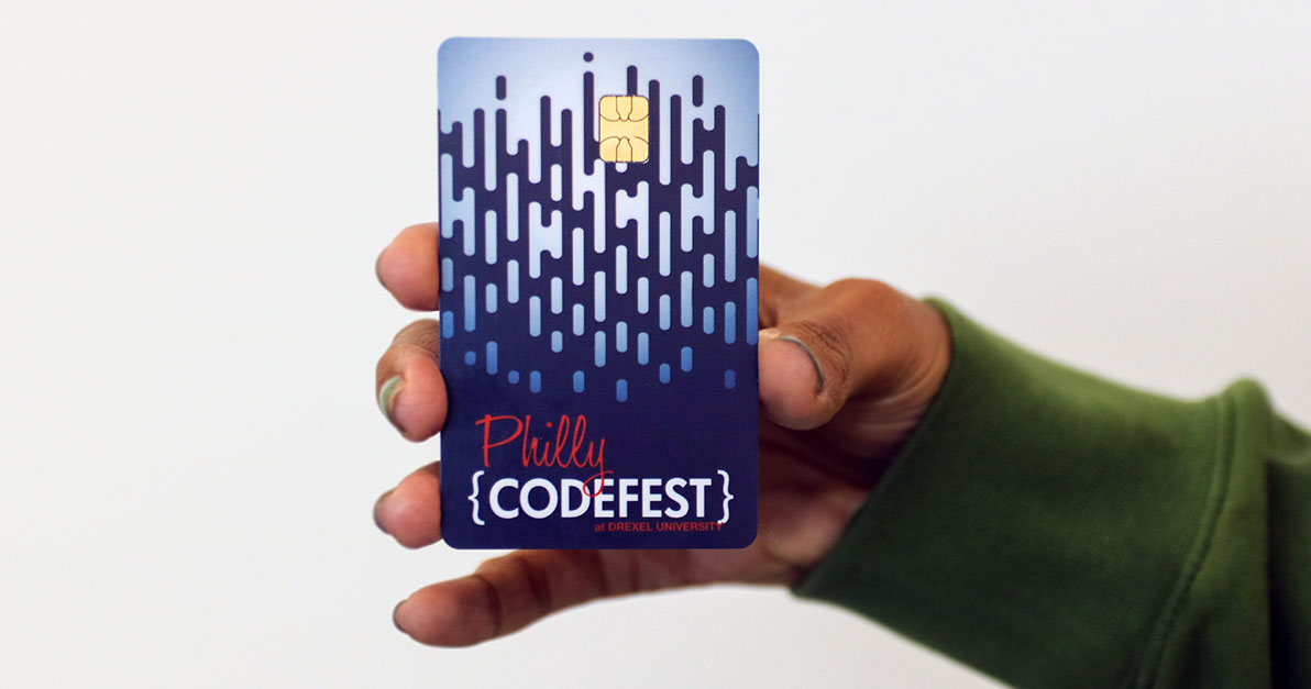 Image of hand holding Philly Codefest branded CyberONE card
