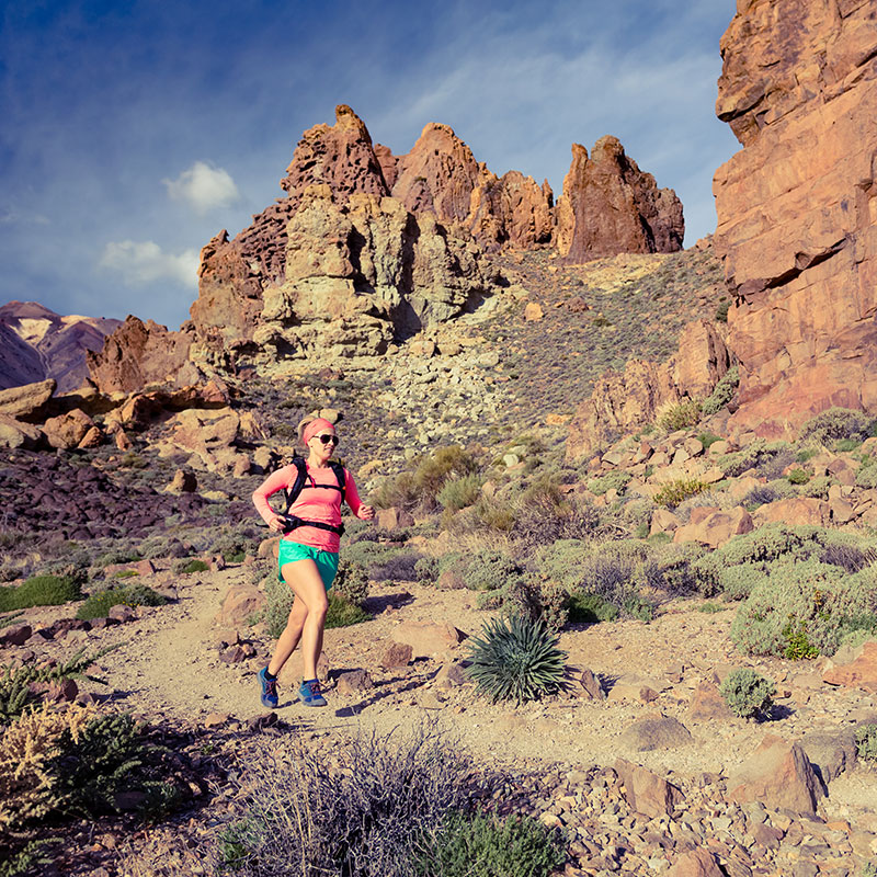 Image of woman running through the desert