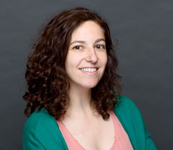 Nicole Bouranis headshot in front of a grey background