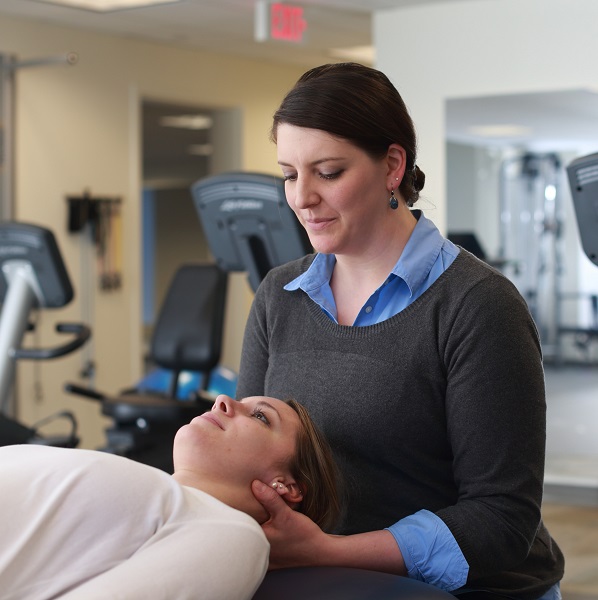 Sara Tomszewski, PT, DPT working with a patient