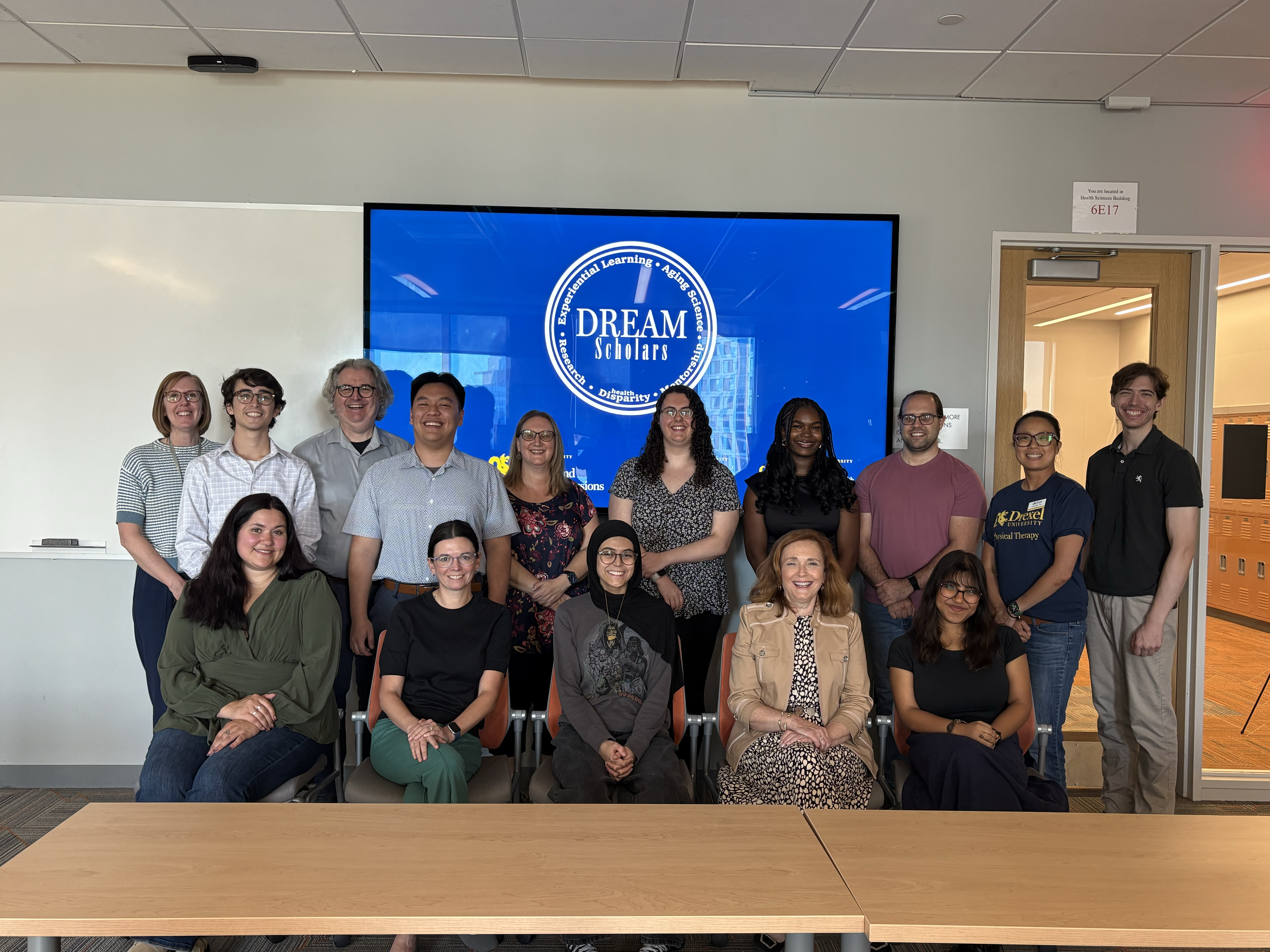 inaugural cohort of DREAM scholars posed with mentors at end-of-year celebration