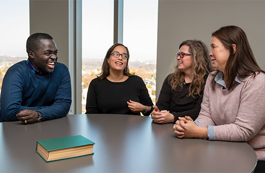 Drexel PhD in Couple and Family Therapy sit at round table talking