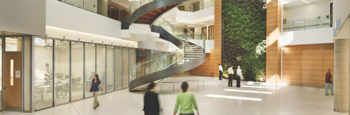 The Biowall and staircase in the Papadakis Integrate Science Building wth people