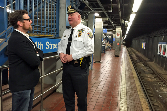 Drexel University Faculty Jordan McClain talking with a police officer about body cameras