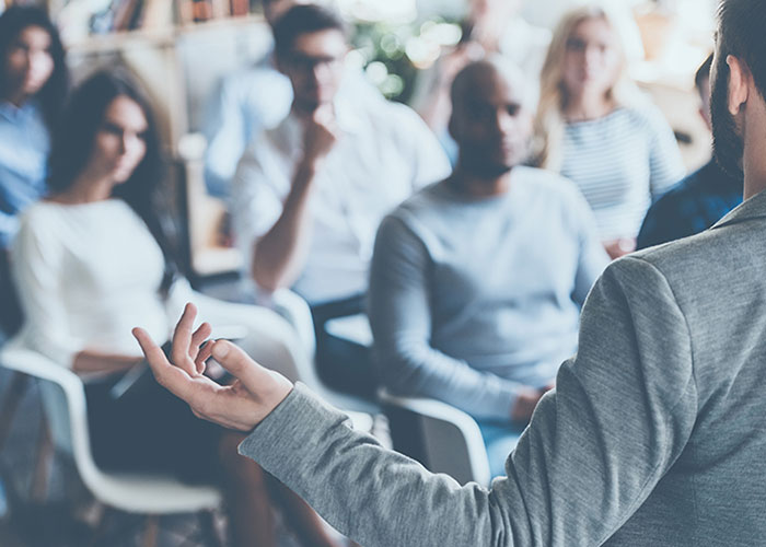 teacher stadning in front of classroom - drexel teaching academy