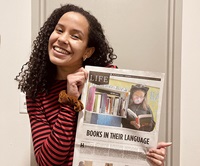 María Paula Mijares Torres poses with a newspaper featuring her first bylined story
