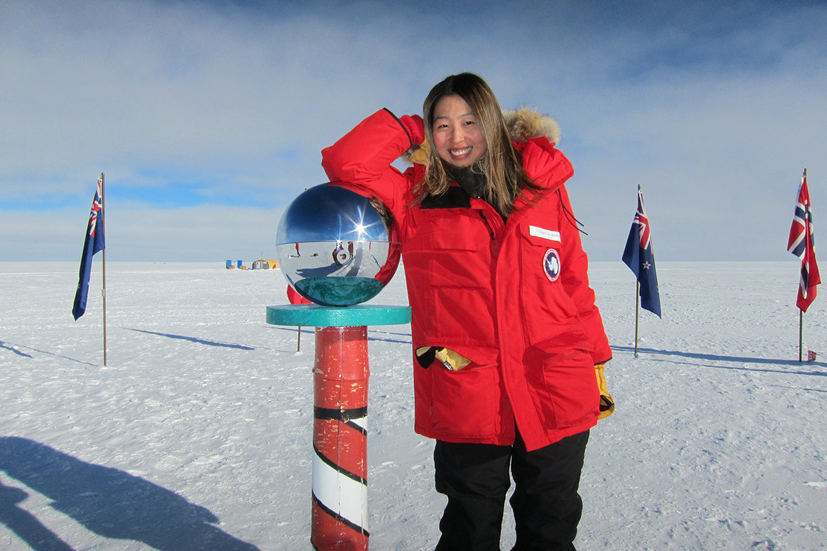Naoko Kurahashi Neilson stands in snow at the geographic South Pole