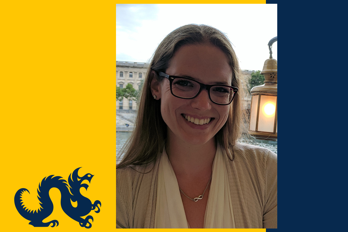 Photo of Megan Bolton on a Drexel blue and gold background