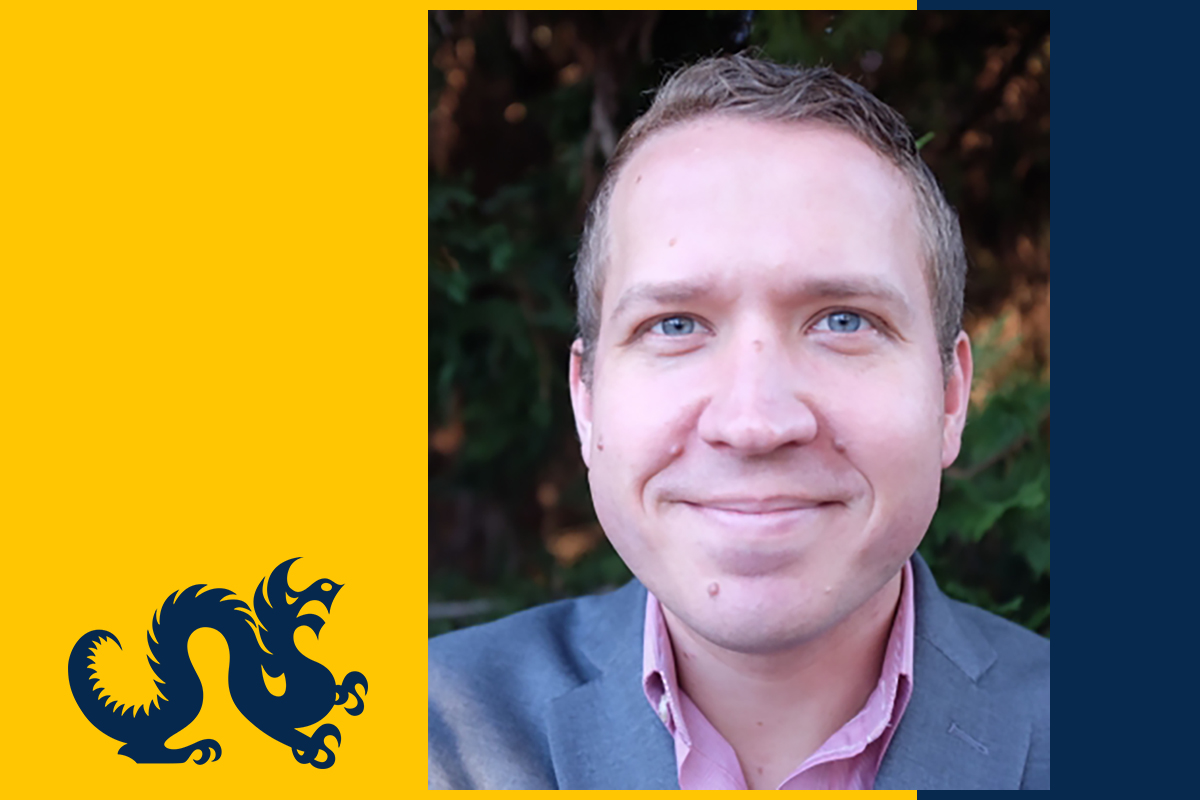 Headshot of Travis Curtice on blue and gold background