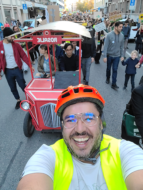 Alejandro Manga takes a selfie while riding in the March for the Climate.