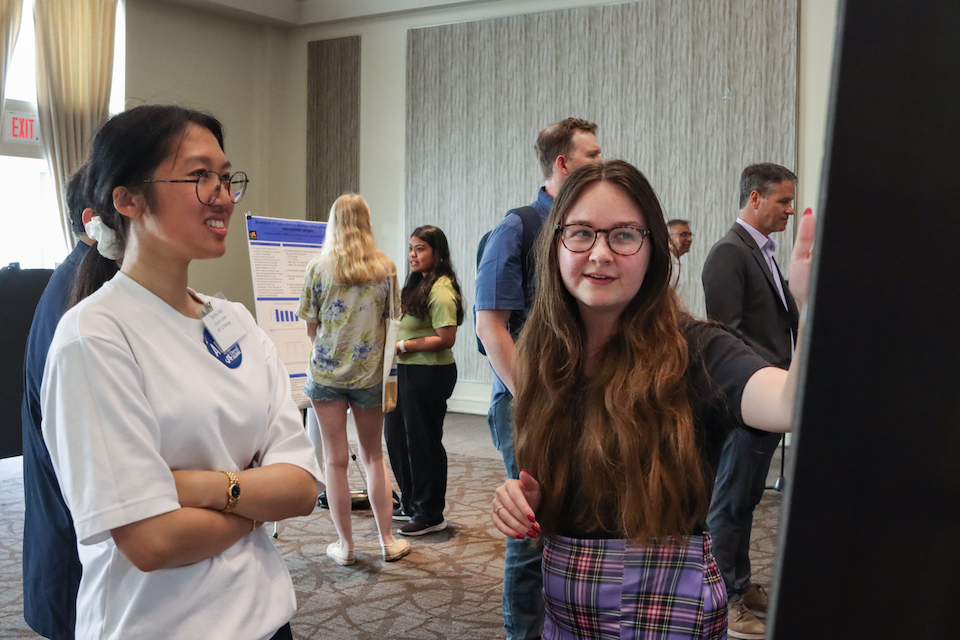 Alumni Judge Tammy Mai at judged student posters at Research Day 2024