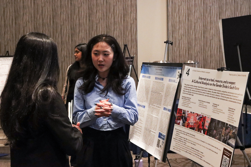 A student presents at the College of Arts and Sciences Research Day