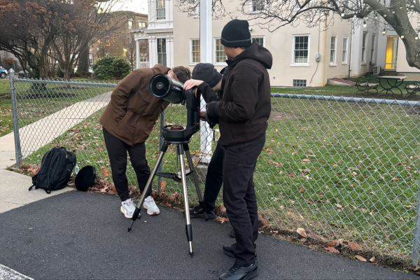 Students look through telescope at Astronomy Night