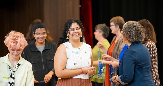 New students are welcoming by Dornsife chairs at a Pinning Ceremony held each September