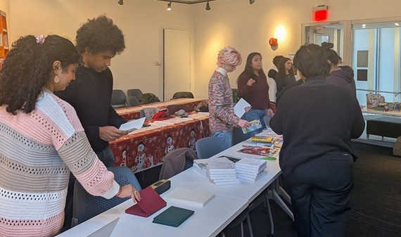 Students selecting materials to make holiday cards