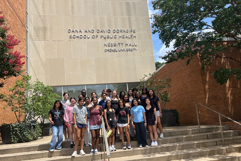 High schoolers enrolled in Drexel Dornsife's Public Health Summer Institute for High School Students gather in front of Nesbitt Hall