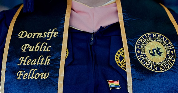 Graduation gown with stole that reads "Dornsife Public Health Fellow"