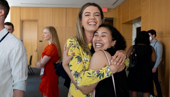 Two alumni hug at the Dornsife 25th anniversary reception during Drexel Alumni Weekend 2022