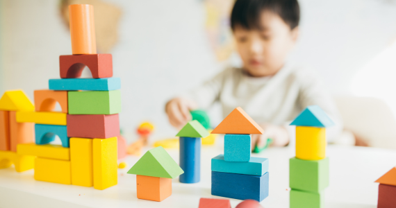 kid playing with blocks