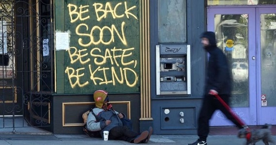 shop boarded up with sign that say "Be back soon. Be safe. Be kind."