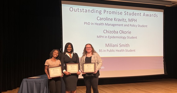 Students hold their placards