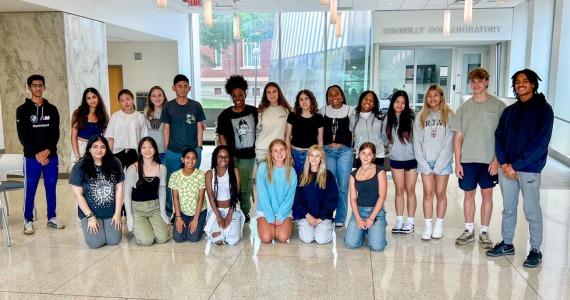 Students in the summer insitute program gather in the Nesbitt Hall lobby for a photograph