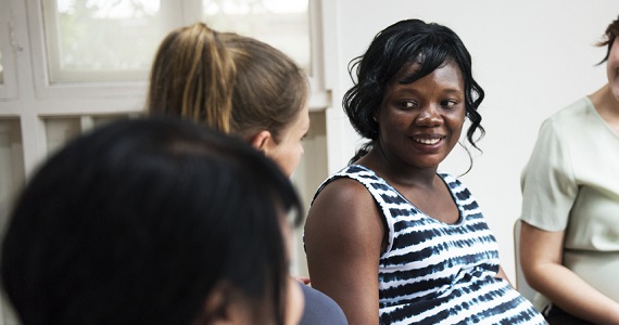 Pregnant women in a group talking