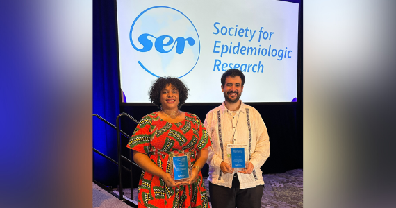 Dr. Barber and Dr. Bilal hold their awards on the SER stage.