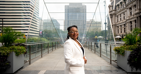 Student standing by city hall in Philadelphia