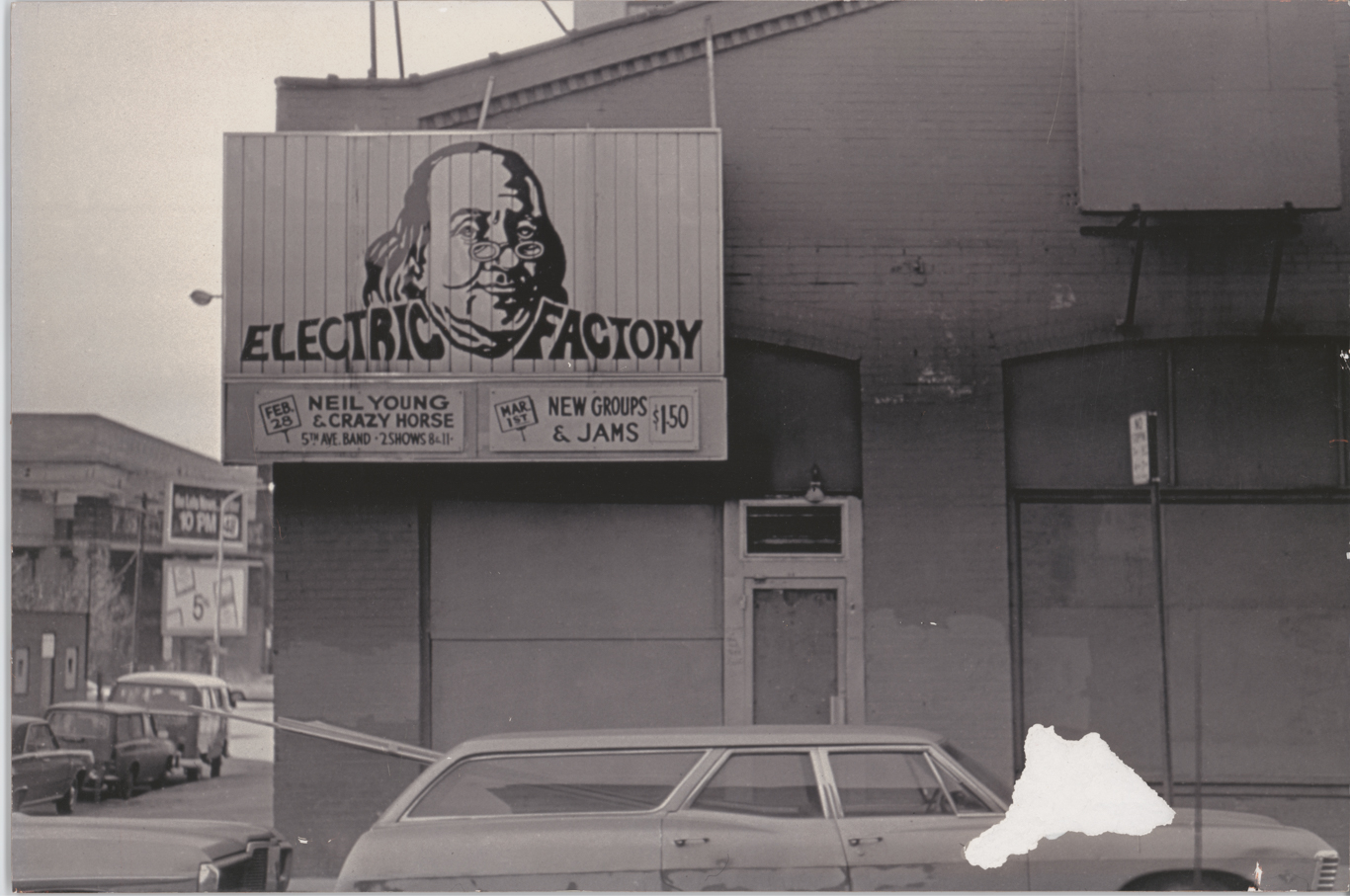 Photograph of exterior original Electric Factory with Ben Franklin sign
