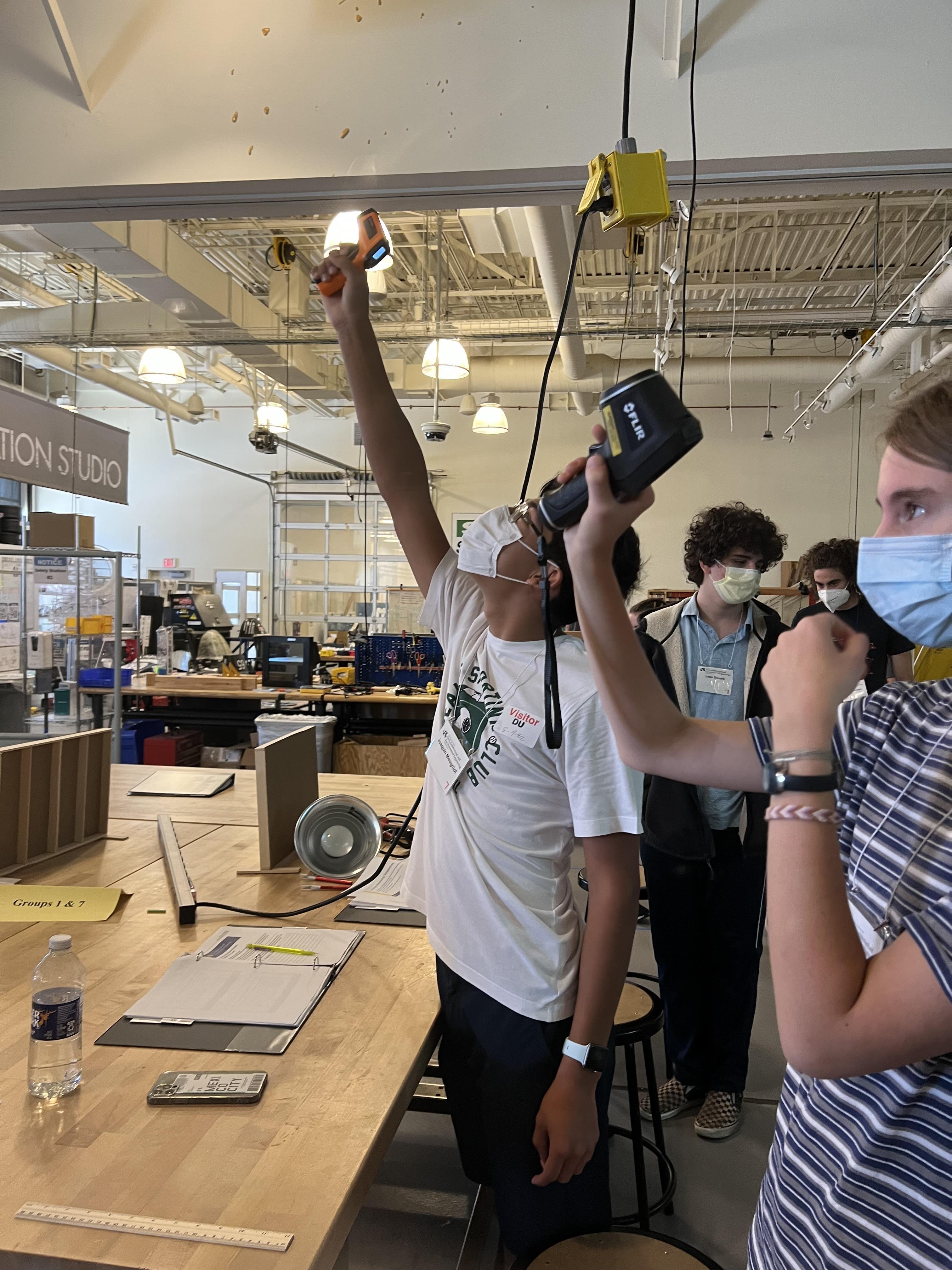 Campers testing the air quality with sensors