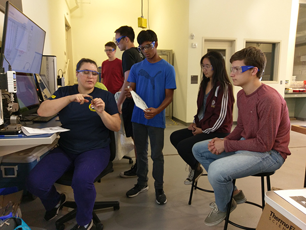 Students learning how to properly mechnically test their 3D-printed polymer samples