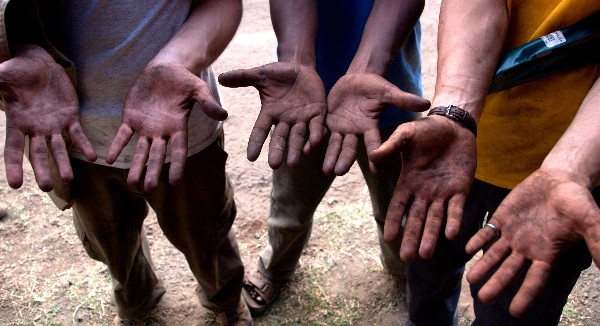 Hands of Drexel Students and members of a community in Africa