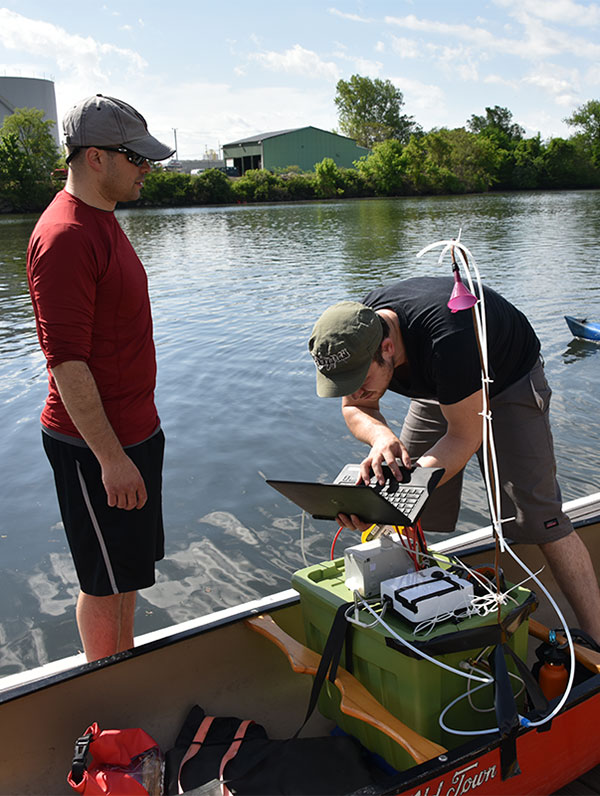 Students prepare equipment to monitor river