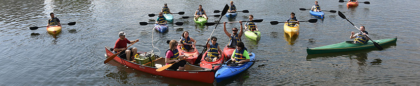 Students in canoes on river