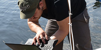 Engineer working along river