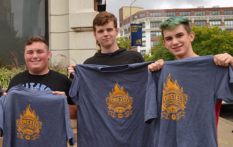 Students show off their t-shirts