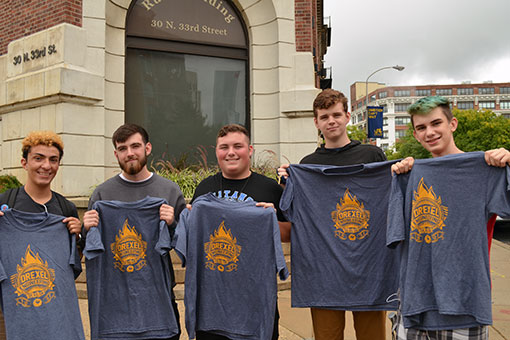 Freshmen show off their new College of Engineering t-shirts.