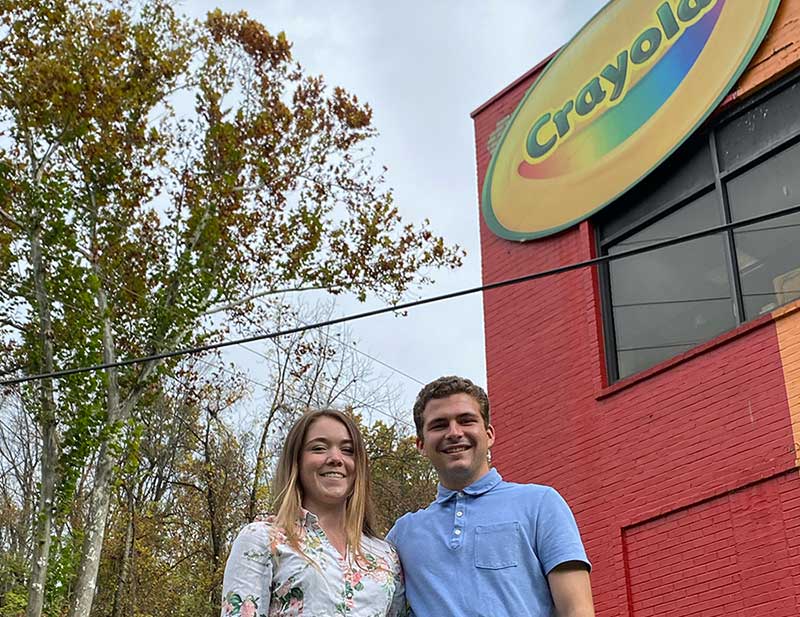 Engineering students in front of Crayola building
