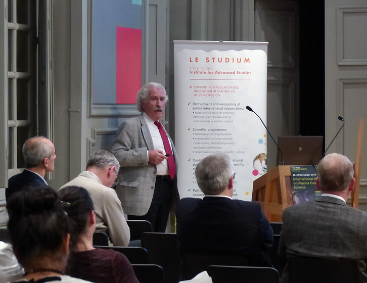 Dr. Alexander Fridman speaking at a conference