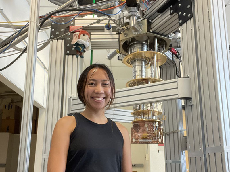 Student in front of lab equipment