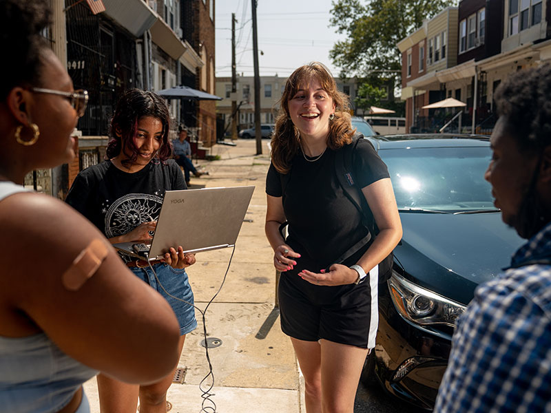 Alyssa Kemp (center) talks with civic scientists as part of her STAR Scholars research on heat issues in Hunting Park.