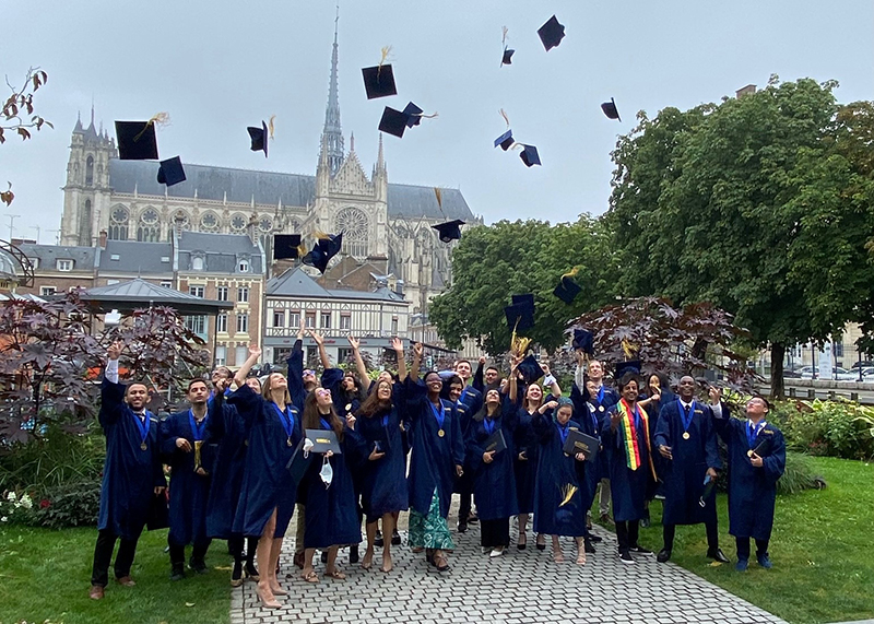 MESC+ 2021 graduating class tossing their caps